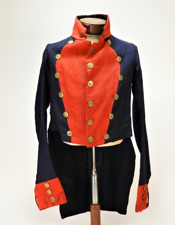 Circa 1820-1840 U.S. militia artillery coatee having a blue plain woven light weight woolen body, red twill woven facings, collar, cuffs, and false pocket flaps ($5,535).